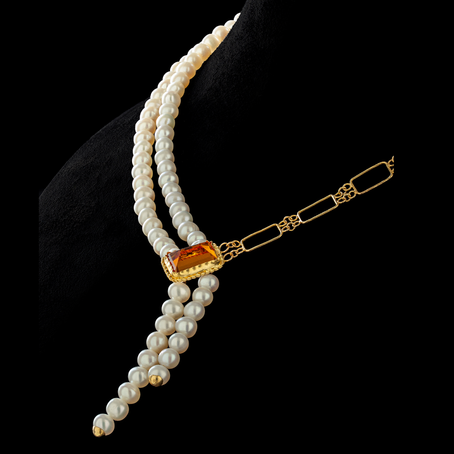 Zaman's Legacy necklace: Timeless elegance. Lustrous pearls, radiant topaz, and modern gold create a cherished heirloom.