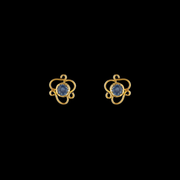 Skylit light blue sapphire stud earrings set in 21 karat gold, offering elegance and timeless beauty.