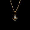 elestial Flutter sapphire pendant: A handcrafted 21-karat gold butterfly pendant with a light blue sapphire gemstone