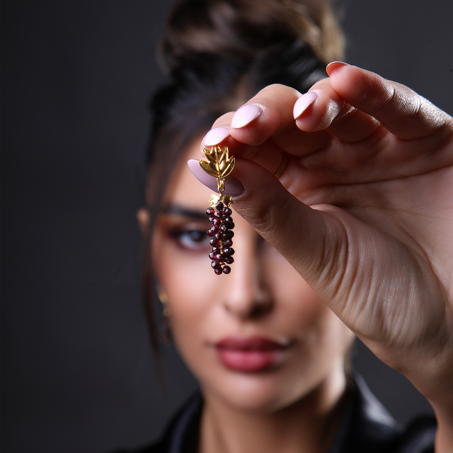 Golden Vine Jewelry Set featuring 21 karat gold earrings with intricate grapevine motifs, symbolizing luxury and abundance.